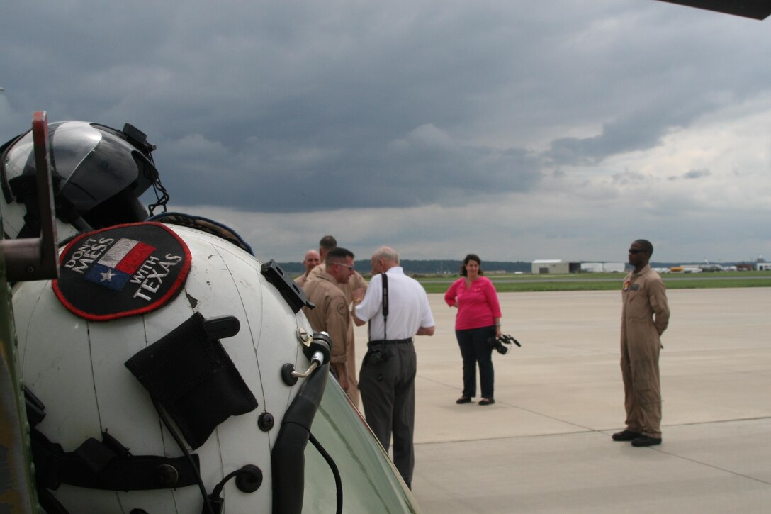 O’Donnell conversing with his colleagues and fellow Marines after a nostalgic flight with the CH-46 Phrog helicopter. O’Donnell’s close colleagues congratulate him on his final flight.