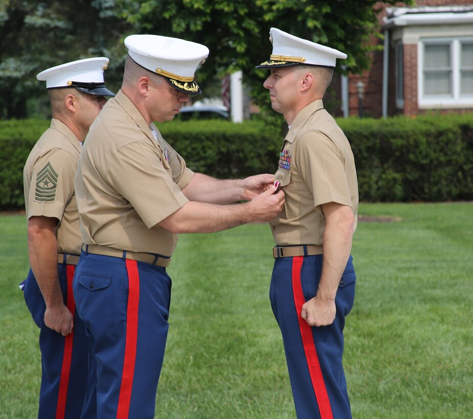 U.S. Marine Corps Lt. Col. Gerald Murphy, left, awards U.S. Marine Corps Lt. Col. Donald Moor, 4th Marine Corps District Executive Officer, with the Meritorious Service Medal during a ceremony at the Defense Distribution Center Susquehanna in New Cumberland, Pennsylvania, July 2, 2015. Moor, a Lebanon, Missouri native, retired from active duty after serving 24 years in the United States Marine Corps. (U.S. Marine Corps photo by Cpl. Kyle Welshans/Released)