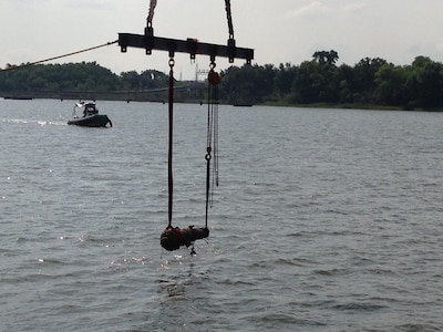 SAVANAH, GA. -- The U.S. Navy's Supervisor of Salvage and Diving provided salvage assistance to recover the first cannon from the Civil War-era Confederate States Ship Georgia on July 21.  The cannon was rigged by U.S. Navy Explosive Ordnance Disposal divers in Savannah, Georgia harbor and deposited in a wet storage container for transport ashore and conservation.