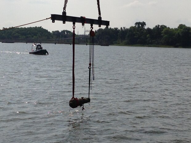 SAVANAH, GA. -- The U.S. Navy's Supervisor of Salvage and Diving provided salvage assistance to recover the first cannon from the Civil War-era Confederate States Ship Georgia on July 21.  The cannon was rigged by U.S. Navy Explosive Ordnance Disposal divers in Savannah, Georgia harbor and deposited in a wet storage container for transport ashore and conservation.