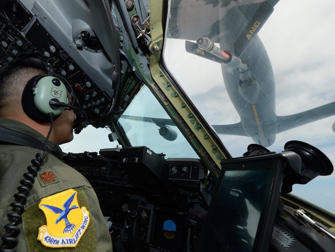 Maj. Dennis Menjivar, the 436th Airlift Wing Inspector General chief of exercises and a C-17 Globemaster III pilot, monitors the approach to contact position with a KC-135R Stratotanker during a training mission over Ohio July 13, 2015. The KC-135R is assigned to the 171st Air Refueling Wing, Pennsylvania Air National Guard. (U.S. Air Force photo/Greg L. Davis)
