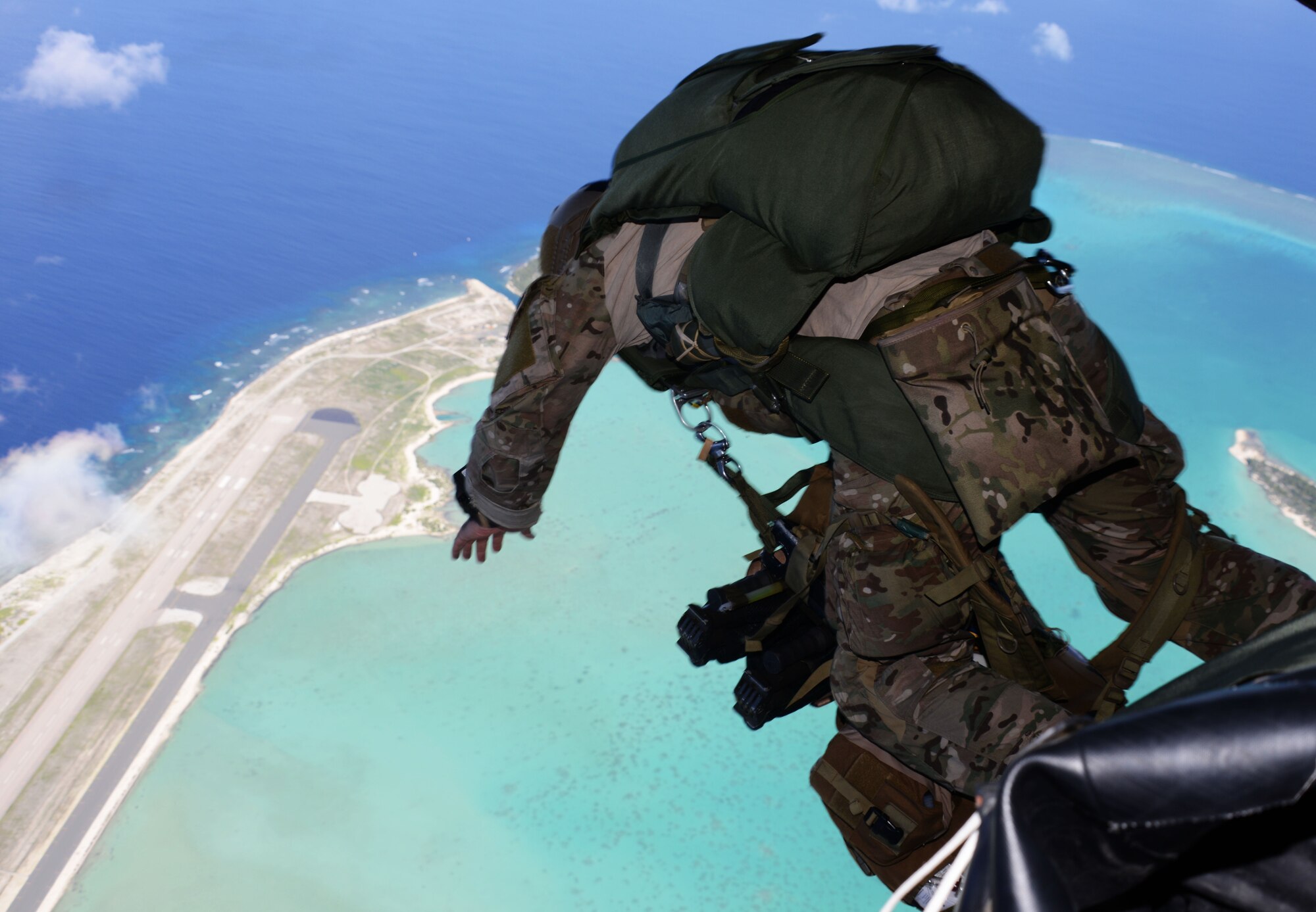 A special tactics team from the 320th Special Tactics Squadron jumps out of an MC-130H Combat Talon II to infil onto Wake Island July 20, 2015.  Members from the 353rd Special Operations Group worked with the 36th Contingency Response Group from Andersen Air Base, Guam, to open Wake Island air field after Typhoon Halola passed through the island. (U.S. Air Force photo  by Tech. Sgt. Kristine Dreyer)