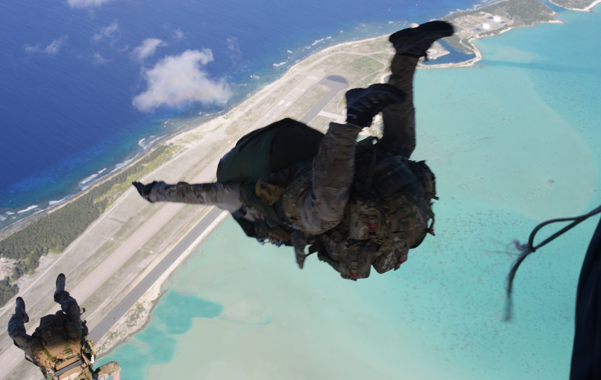 A special tactics team from the 320th Special Tactics Squadron jumps out of an MC-130H Combat Talon II to infil onto Wake Island July 20, 2015.  Members from the 353rd Special Operations Group worked with the 36th Contingency Response Group from Andersen Air Base, Guam, to open Wake Island air field after Typhoon Halola passed through the island. (U.S. Air Force photo  by Tech. Sgt. Kristine Dreyer)