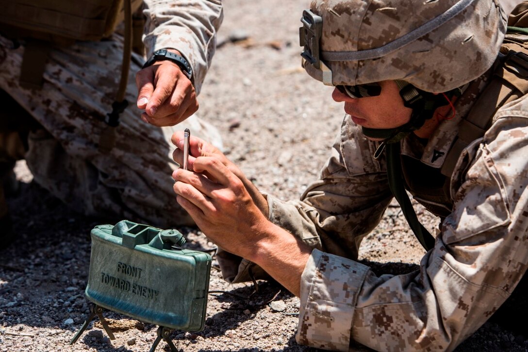 Lance Cpl. Colin Brennan, an assault man with Company A, 1st Battalion, 3rd Marine Regiment, prepares to insert a blasting cap into a claymore during training as the battalion prepares for an Integrated Training Exercise aboard Marine Corps Air Ground Combat Center Twentynine Palms, Calif., July 21. ITX focuses on the tactical application of combined arms maneuver warfare during global contingency operations.