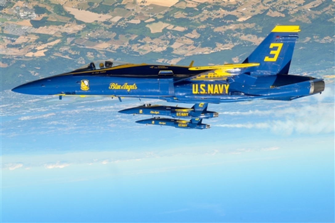 The Blue Angels, the Navy's flight demonstration squadron, perform a line loop maneuver during a practice demonstration at the Oregon International Air Show in Hillsboro, Ore., July 17, 2015. The Blue Angels are scheduled to perform 68 demonstrations at 35 locations across the United States in 2015. 