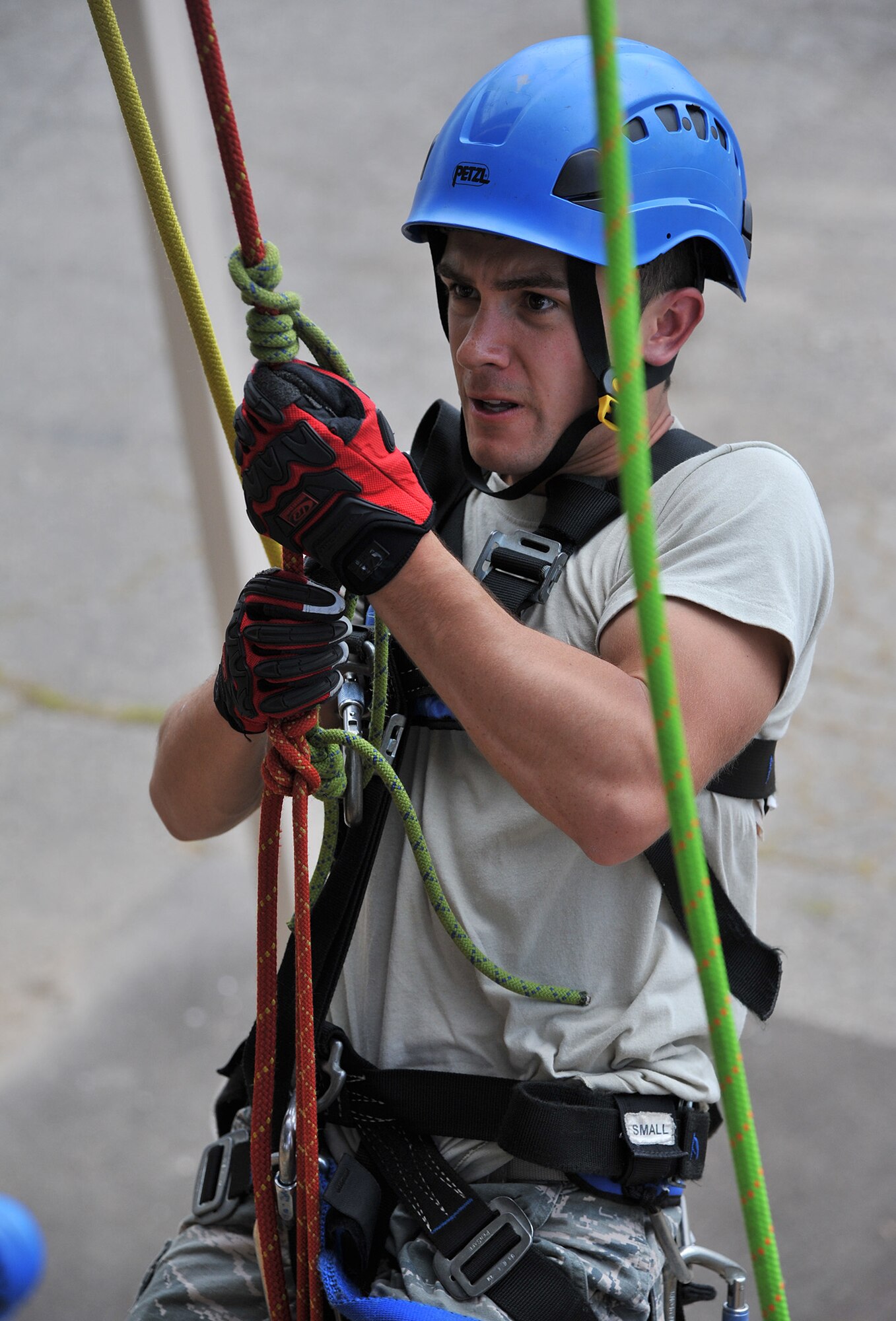 Airman 1st Class Ian Pieroni, 341st Civil Engineer Squadron firefighter, Malmstrom Air Force Base, Mont., ascends the tower at the City of Great Falls Fire Training Center during advanced rescue training July 22, 2015. Instructors from Goodfellow AFB, Texas, were in Great Falls to teach Air Force firefighters from Malmstrom, F.E. Warren AFB, Wyo., Ellsworth AFB, S.D., and the Montana Air National Guard advanced rescue techniques. The course is 15 days of training. (U.S. Air Force photo/ John Turner)