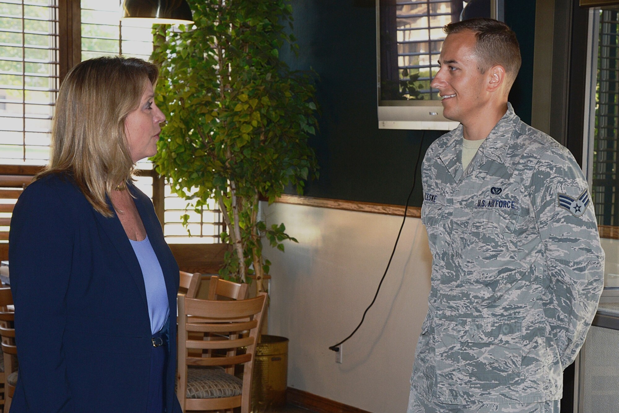 Secretary of the Air Force Deborah Lee James talks with Senior Airman Elisha Andrew O’Leske, 729th Air Control Squadron, prior to an Airman luncheon Thursday, July 23, at Hill Air Force Base, Utah. O’Leske was one of 23 Team Hill Airmen who ate lunch with James at the Hillcrest Dining Facility. (U.S. Air Force photo by Alex R. Lloyd/Released)