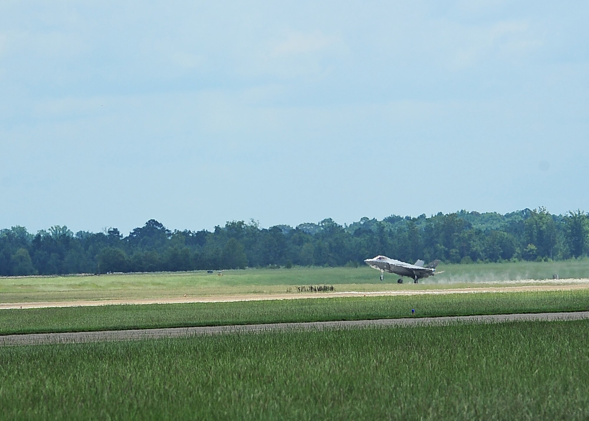 An F-35A Lightning II aircraft, piloted by Brig. Gen. Scott Pleus, 56th Fighter Wing Commander, Luke Air Force Base, Arizona, lands on the center runway July 23 on Columbus Air Force Base, Mississippi. Pleus is the graduation speaker for Specialized Undergraduate Pilot Training Class 15-12. (U.S. Air Force photo/Airman 1st Class Daniel Lile)