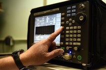 Bruce Clark, 341st Communications Squadron base radio electronics technician, performs a systems check on a land mobile radio, July 21, 2015, at Malmstrom Air Force Base, Mont.  The shop dispatches out to various repeater sites in the missile field to perform preventative maintenance and repair inoperative base stations. (U.S. Air Force photo/Chris Willis)