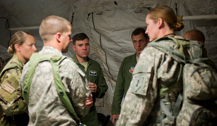 U.S. Air Force Capt. Erik Gonsalves, 75th Fighter Squadron A-10 Thunderbolt II instructor pilot, meets with U.S. Army service members in support of Green Flag West 15-08.5 on the National Training Center range at Fort Irwin, Calif., July 16, 2015. This was the first time Air Force pilots met face-to-face with the U.S. Army troops on the ground to discuss tactics that were going to be employed during this Green Flag West exercise. (U.S. Air Force photo by Airman 1st Class Mikaley Towle) 