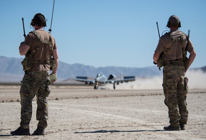 Airmen assigned to the 22nd Special Tactics Squadron, Joint Base Lewis-McChord, Wash., watch as an A-10 Thunderbolt II lands in support of Green Flag West 15-08.5 on the National Training Center at Fort Irwin, Calif., July 16, 2015. As combat controllers, part of their job is to operate in remote and sometimes hostile areas helping the Air Force accomplish its mission by directing air traffic and alerting pilots and command of the location of hostile forces on the ground. (U.S. Air Force photo by Airman 1st Class Mikaley Towle)