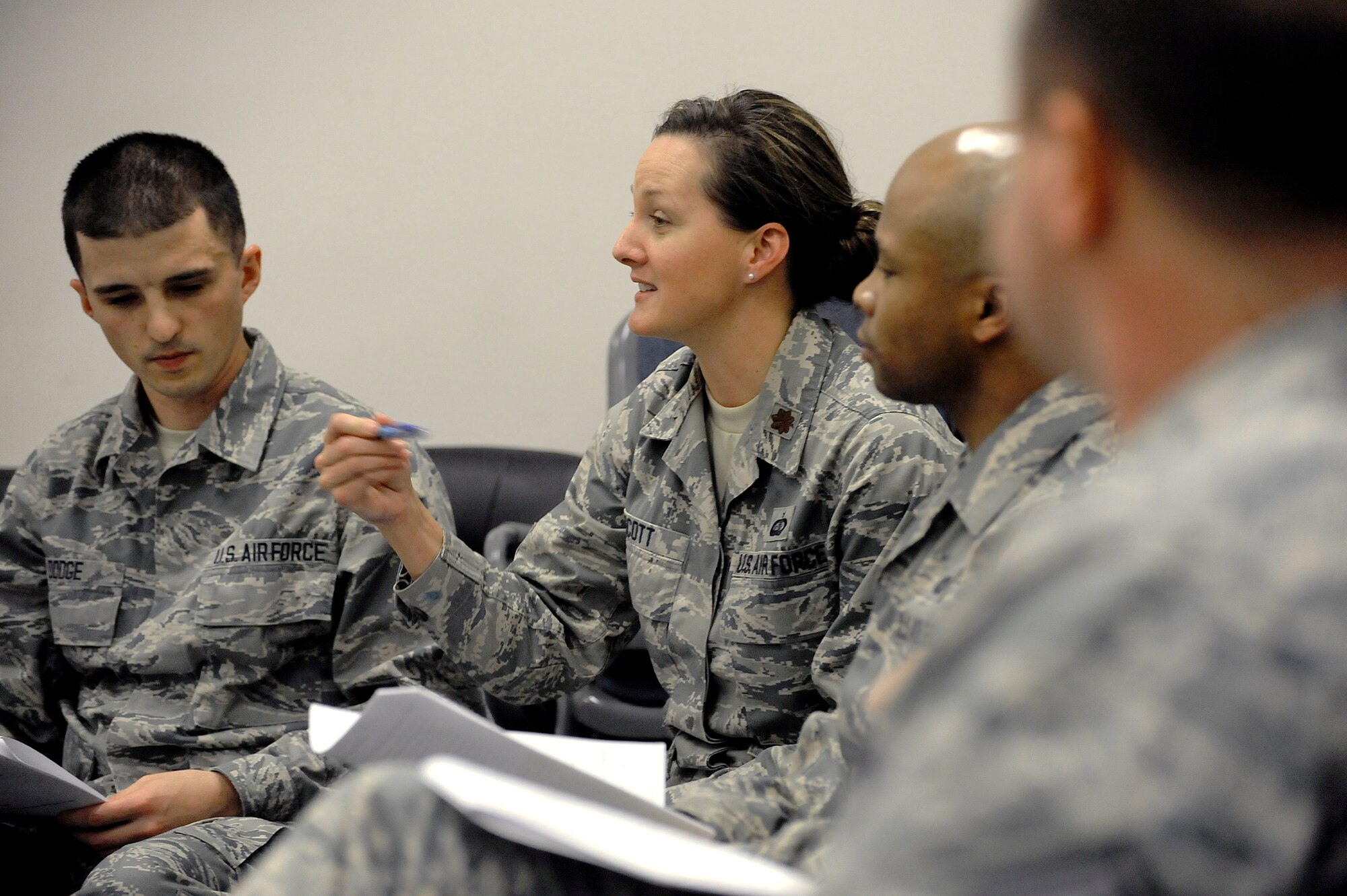 Oregon Air National Guard Maj. Lisa Scott, the Equal Opportunity Director for the 142nd Fighter Wing, center, leads a discussion during the Unit Training Assembly, Dec. 07, 2014, Portland Air National Guard Base, Ore. The Diversity and Inclusion Counsel meets during Unit Training Assembly weekends to help develop the total force crucial for mission success. (U.S. Air Force photo by Tech. Sgt. John Hughel, 142nd Fighter Wing Public Affairs/Released)