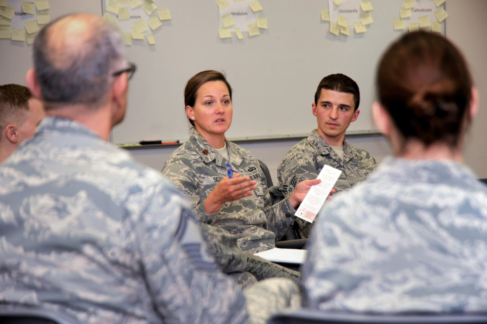 Oregon Air National Guard Maj. Lisa Scott, the Equal Opportunity Director for the 142nd Fighter Wing, center, leads a discussion during the Unit Training Assembly, Dec. 07, 2014, Portland Air National Guard Base, Ore. The Diversity and Inclusion Counsel helps foster communication by recognizing that a diverse set of experiences, perspectives, and backgrounds are crucial to mission success. (U.S. Air National Guard photo by Tech. Sgt. John Hughel, 142nd Fighter Wing Public Affairs/Released)