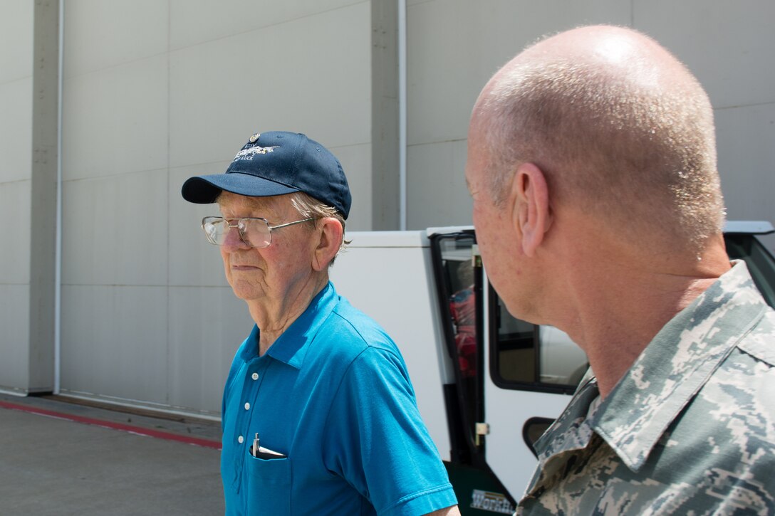 Members of the Living Community of St. Joseph tour Rosecrans Air National Guard Base, St. Joseph, Mo.,  on July 23, 2015. Mike Fisher, who is also a veteran, fought in World War II while he was assigned to Rosecrans when it was a bomber wing.  Fisher said he was a radio operator who has flown 33 missions over Germany and was shot down once over France. (U.S. Air National Guard photo by Senior Airman Bruce Jenkins)