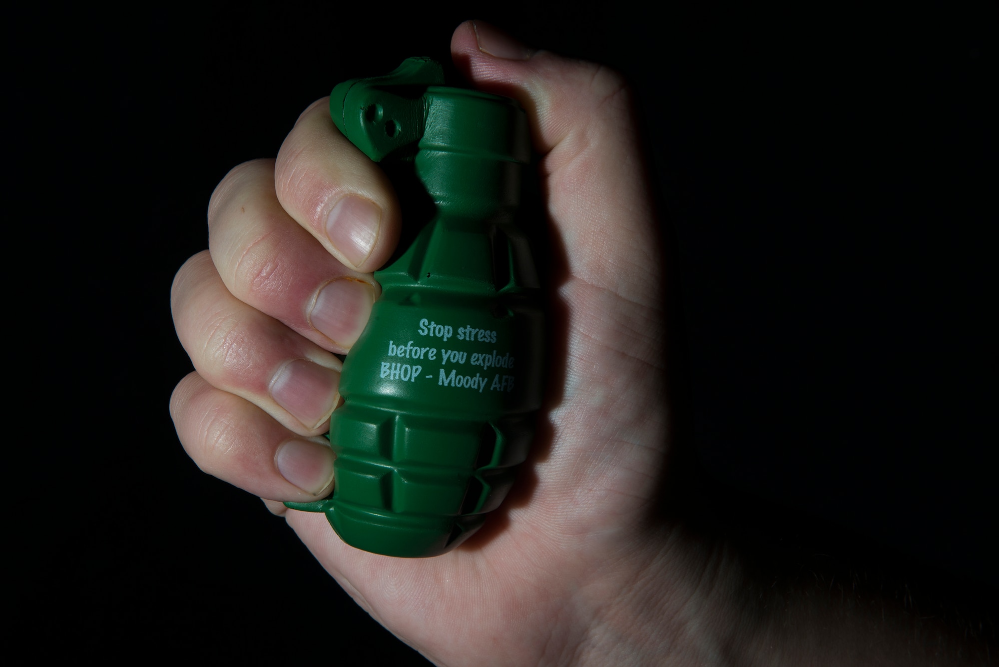An Airman squeezes a Behavioral Health Optimization Program stress ball July 21, 2015, at Moody Air Force Base, Ga. The BHOP can help with emotional or behavioral problems such as grief, excess stress, depression, anxiety, anger or difficulties within relationships. (U.S. Air Force photo by Airman 1st Class Kathleen D. Bryant)
