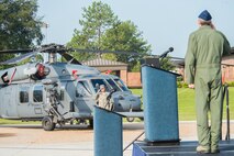 U.S. Air Force Col. Thomas Kunkel, (right), 23d Wing commander, renders a salute to Staff Sgt. Stephanie Hill, during the 23d WG Change of Command ceremony July 23, 2015, at Moody Air Force Base, Ga. Hill revealed Kunkel’s name on his flagship HH-60G Pave Hawk. (U.S. Air Force photo by Airman 1st Class Ceaira Tinsley/Released)