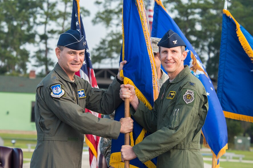 U.S. Air Force Maj. Gen. H.D. Polumbo Jr. (left), Ninth Air Force commander, and Col. Thomas Kunkel, 23d Wing commander, pose for a photo during the 23d WG Change of Command ceremony July 23, 2015, at Moody Air Force Base, Ga. Kunkel was the director of the Joint Personnel Recovery Agency. (U.S. Air Force photo by Airman 1st Class Ceaira Tinsley/Released)