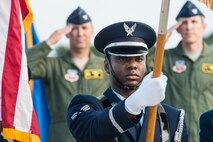 U.S. Air Force Senior Airman Braden Anderson, Moody Air Force Base Honor Guard, presents the colors during the 23d Wing Change of Command ceremony July 23, 2015, at Moody Air Force Base, Ga. A change of command is a symbolic military tradition where a new leader assumes command in front of their unit. (U.S. Air Force photo by Airman 1st Class Ceaira Tinsley/Released)