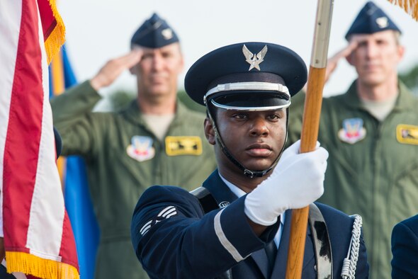U.S. Air Force Senior Airman Braden Anderson, Moody Air Force Base Honor Guard, presents the colors during the 23d Wing Change of Command ceremony July 23, 2015, at Moody Air Force Base, Ga. A change of command is a symbolic military tradition where a new leader assumes command in front of their unit. (U.S. Air Force photo by Airman 1st Class Ceaira Tinsley/Released)