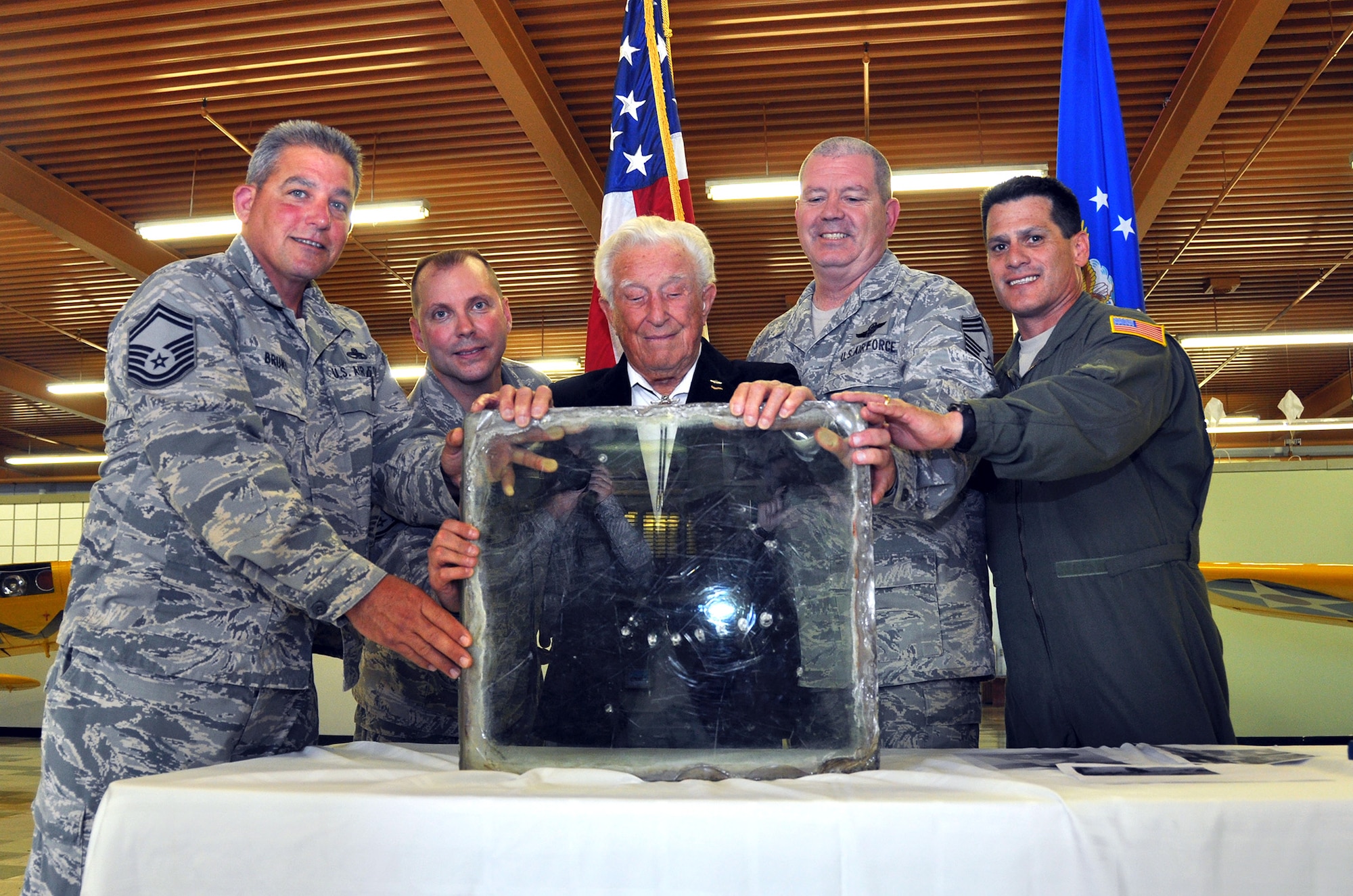 Members of the 70th and 79th Air Refueling Squadrons presented Bruce Sooy with a B-24 windshield at the Travis Air Force Base Heritage Center, April 8, 2014. (U.S. Air Force photo/Staff Sgt. Cindy G. Alejandrez)