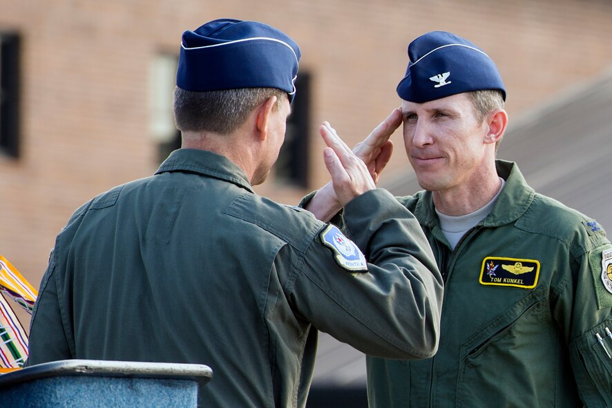 U.S. Air Force Col. Thomas Kunkel, 23d Wing commander, renders a salute to Maj. Gen. H.D. Polumbo Jr., Ninth Air Force commander, after assuming command during the 23d WG Change of Command ceremony July 23, 2015, at Moody Air Force Base, Ga. Moody welcomed back Kunkel who was formerly the 41st Rescue Squadron commander in 2009. (U.S. Air Force photo by Airman Greg Nash/Released)