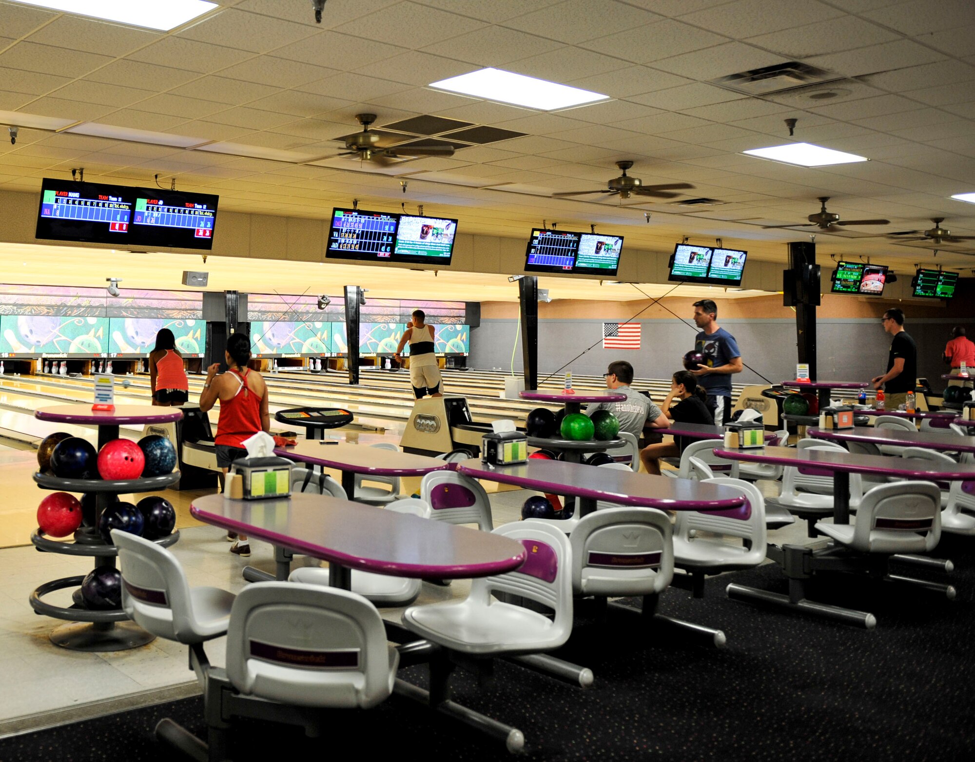 Team Little Rock members bowl the night away July 8, 2015, at Little Rock Air Force Base, Ark. Strike Zone Bowling Center offers specials almost daily. (U.S. Air Force photo by Senior Airman Stephanie Serrano)