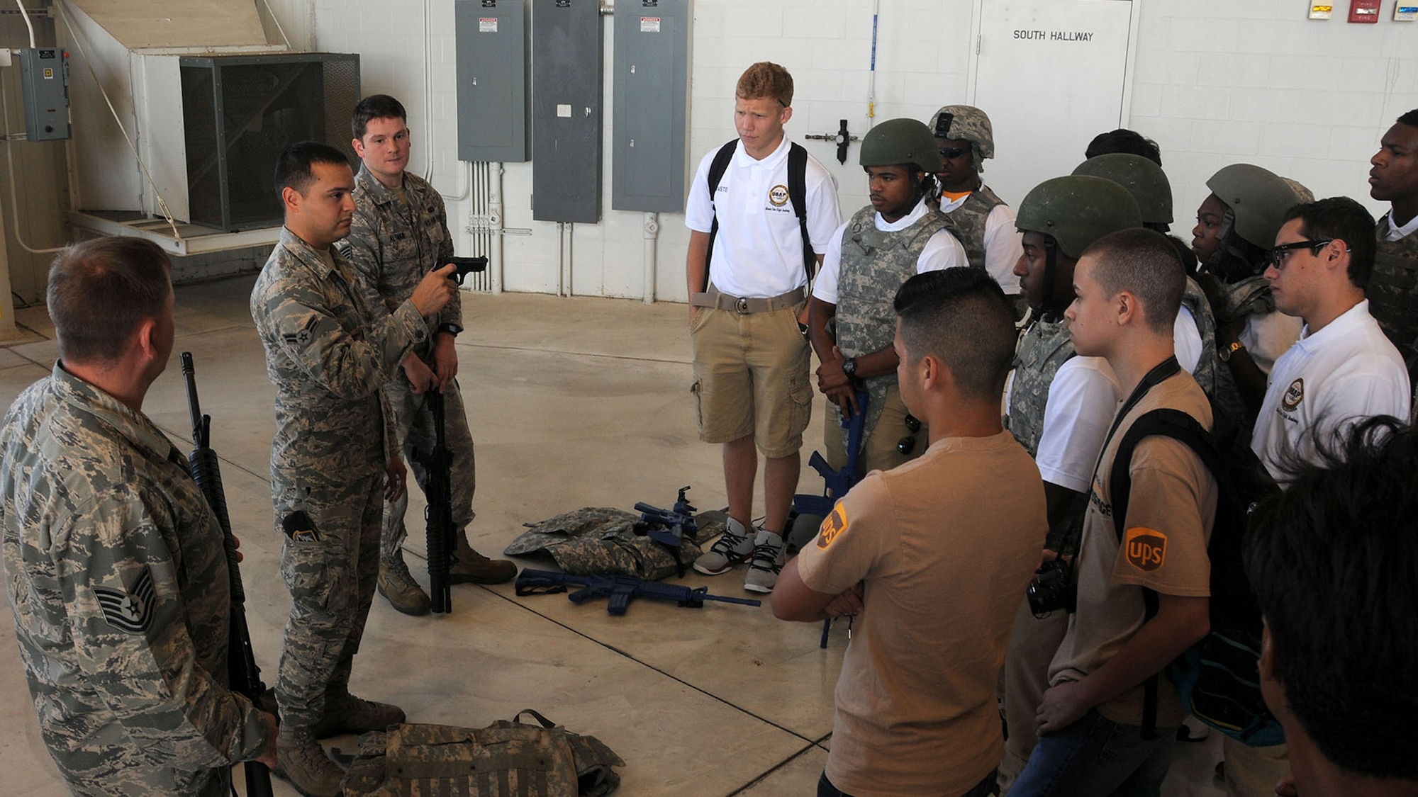 WRIGHT-PATTERSON AIR FORCE BASE, Ohio –Airman 1st Class Tyler Acevedo, 445th Security Forces Squadron, shows Dream Flight the various equipment and gear SFS uses during the group’s visit to the 445th Airlift Wing July 22, 2015. More than 180 students ages 14-18 and their chaperons visited the wing as part of the 16th Annual Delta Airlines sponsored Dream Flight program. (U.S. Air Force photo/Tech. Sgt. Anthony Springer)