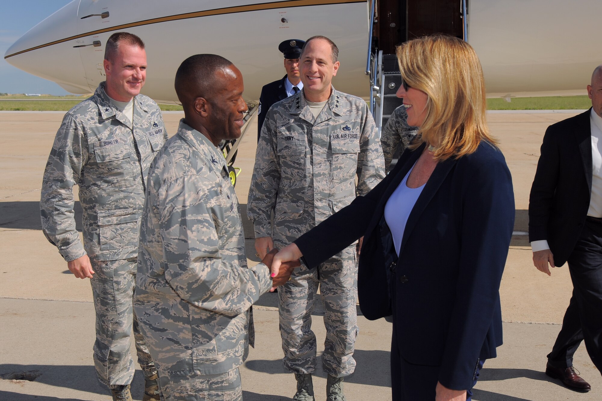 Secretary of the Air Force Deborah Lee James is greeted by Col. Ronald Jolly, 75th Air Base Wing commander, after arriving at Hill Air Force Base, Utah, Thursday, July 23. While at Hill, James will receive an overview of the scope and mission of the base, and she will host an all-call with Team Hill personnel. (U.S. Air Force photo by Todd Cromar)