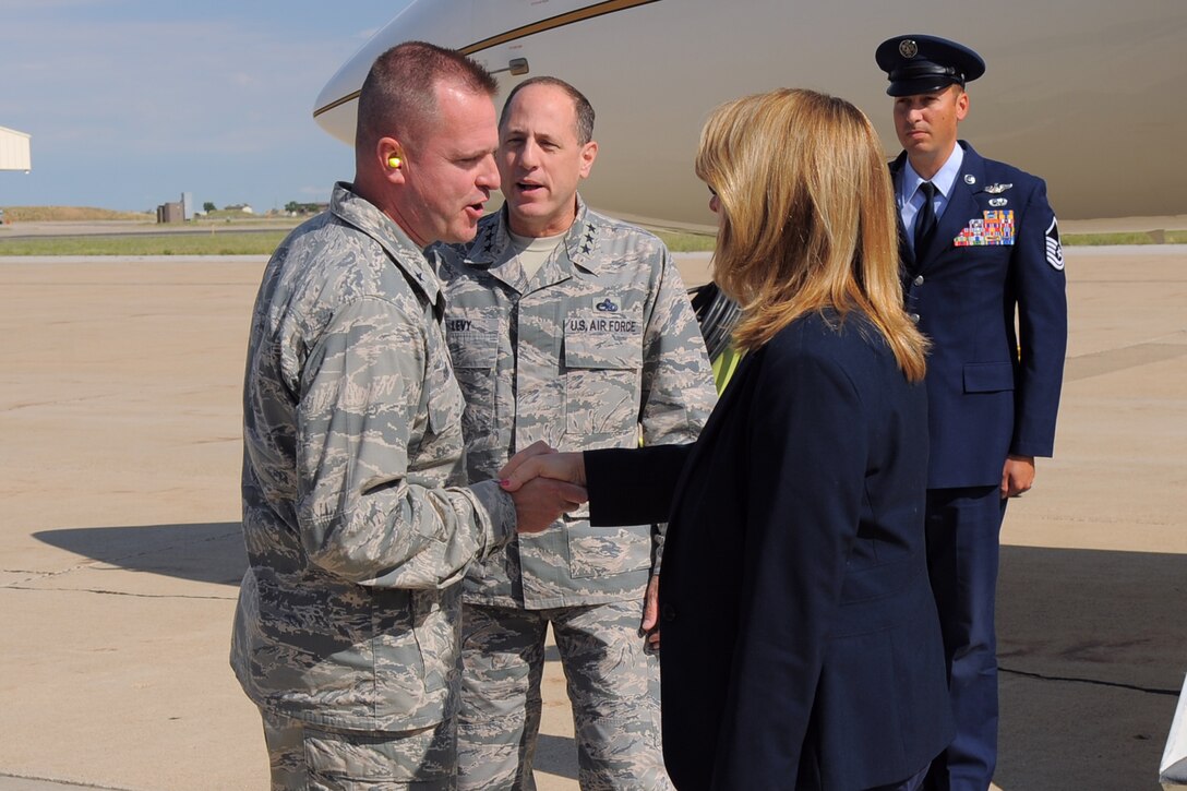 Secretary of the Air Force Deborah Lee James is greeted by Brig. Gen. Carl A. Buhler, Ogden Air Logistics Complex commander, after arriving at Hill Air Force Base, Utah, Thursday, July 23. While at Hill, James will receive an overview of the scope and mission of the base, and she will host an all-call with Team Hill personnel. (U.S. Air Force photo by Todd Cromar)