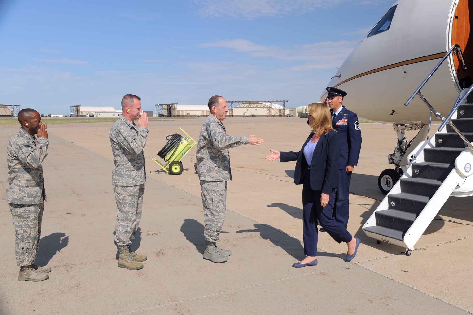 Secretary of the Air Force Deborah Lee James is greeted by, from the right, Lt. Gen. Lee K. Levy II, Air Force Sustainment Center commander, Brig. Gen. Carl A. Buhler, Ogden Air Logistics Complex commander, and Col. Ronald Jolly, 75th Air Base Wing commander, after arriving at Hill Air Force Base, Utah, Thursday, July 23. While at Hill, James will receive an overview of the scope and mission of the base, and she will host an all-call with Team Hill personnel. (U.S. Air Force photo by Todd Cromar)