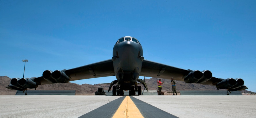 A B-52H Stratofortress assigned to the 69th Bomb Squadron, Minot Air Force Base, N.D., sits through pre-flight checks during Red Flag 15-3 at Nellis Air Force Base, Nev. July 15, 2015. The B-52 has a wide array of weapons at its disposal to dispose of an enemy and is capable of delivering approximately 70,000 pounds of munitions. (U.S. Air Force photo by Senior Airman Thomas Spangler)