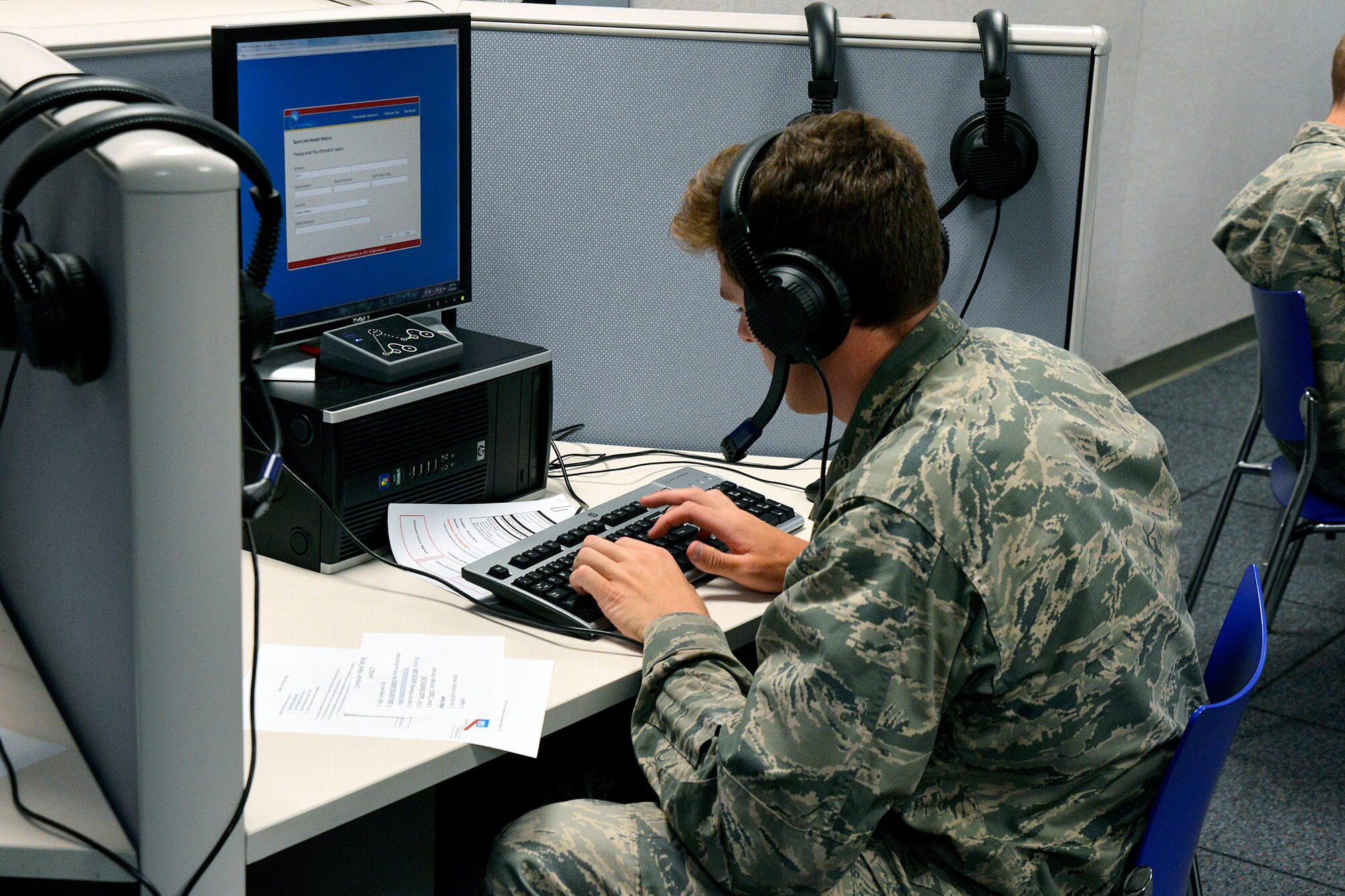 A basic cadet at the U.S. Air Force Academy completes a concussion history and symptom inventory here June 13, 2015. All cadets are taking part in a three-year, $30M collaboration between the Defense Department and the NCAA  to study concussions. Eighteen universities in the United States and the U.S. military service academies are taking part in the research project. (U.S. Air Force photo/Jason Gutierrez)  