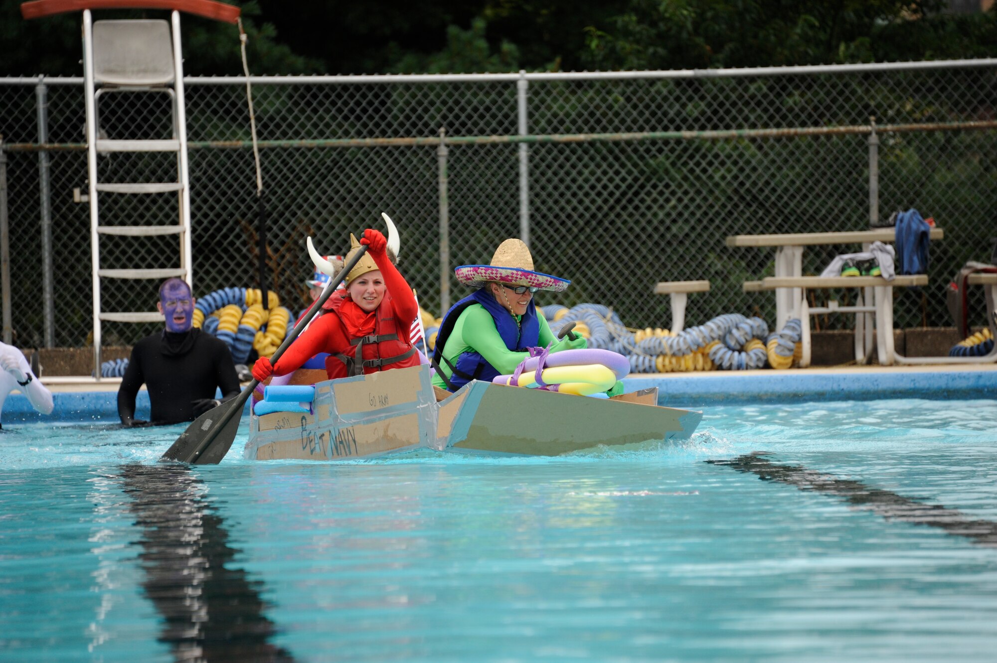 The Fourth Annual Cardboard Boat Regatta was held at the Dix Outdoor Pool on Joint Base McGuire-Dix-Lakehurst, N.J. July 18, 2015. Nine crews consisting of service members and civilians, utilizing sheets of cardboard and duct tape, constructed boats from the initial planning stages to the actual floating of the boats in a contest to determine the fastest time, unique theme, team spirit and dramatic sinking. (U.S. Air Force photo by Pascual Flores)