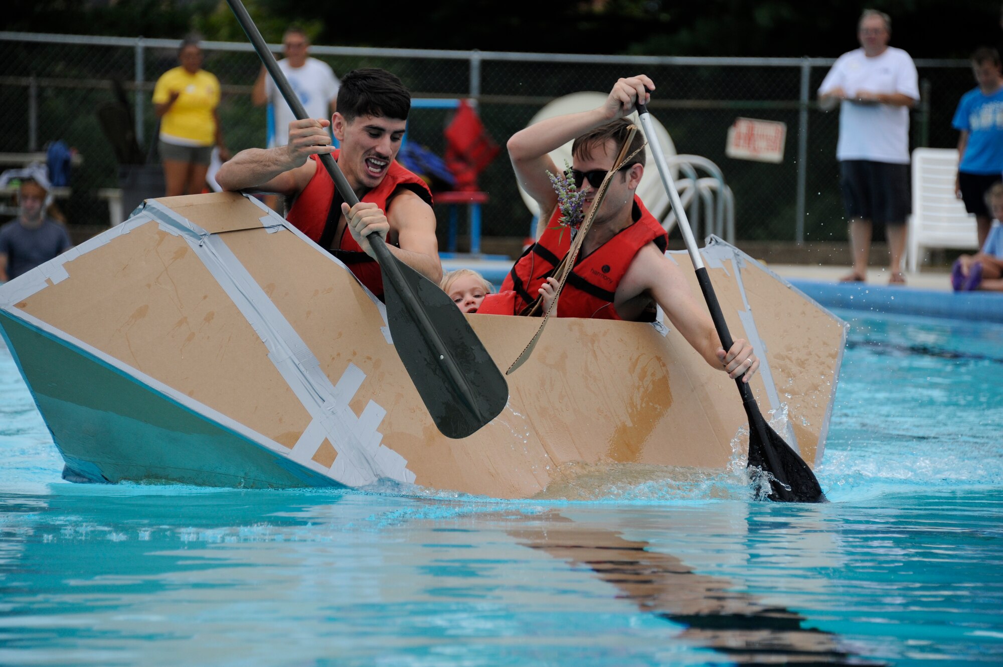 The Fourth Annual Cardboard Boat Regatta was held at the Dix Outdoor Pool on Joint Base McGuire-Dix-Lakehurst, N.J. July 18, 2015. Nine crews consisting of service members and civilians, utilizing sheets of cardboard and duct tape, constructed boats from the initial planning stages to the actual floating of the boats in a contest to determine the fastest time, unique theme, team spirit and dramatic sinking. (U.S. Air Force photo by Pascual Flores)