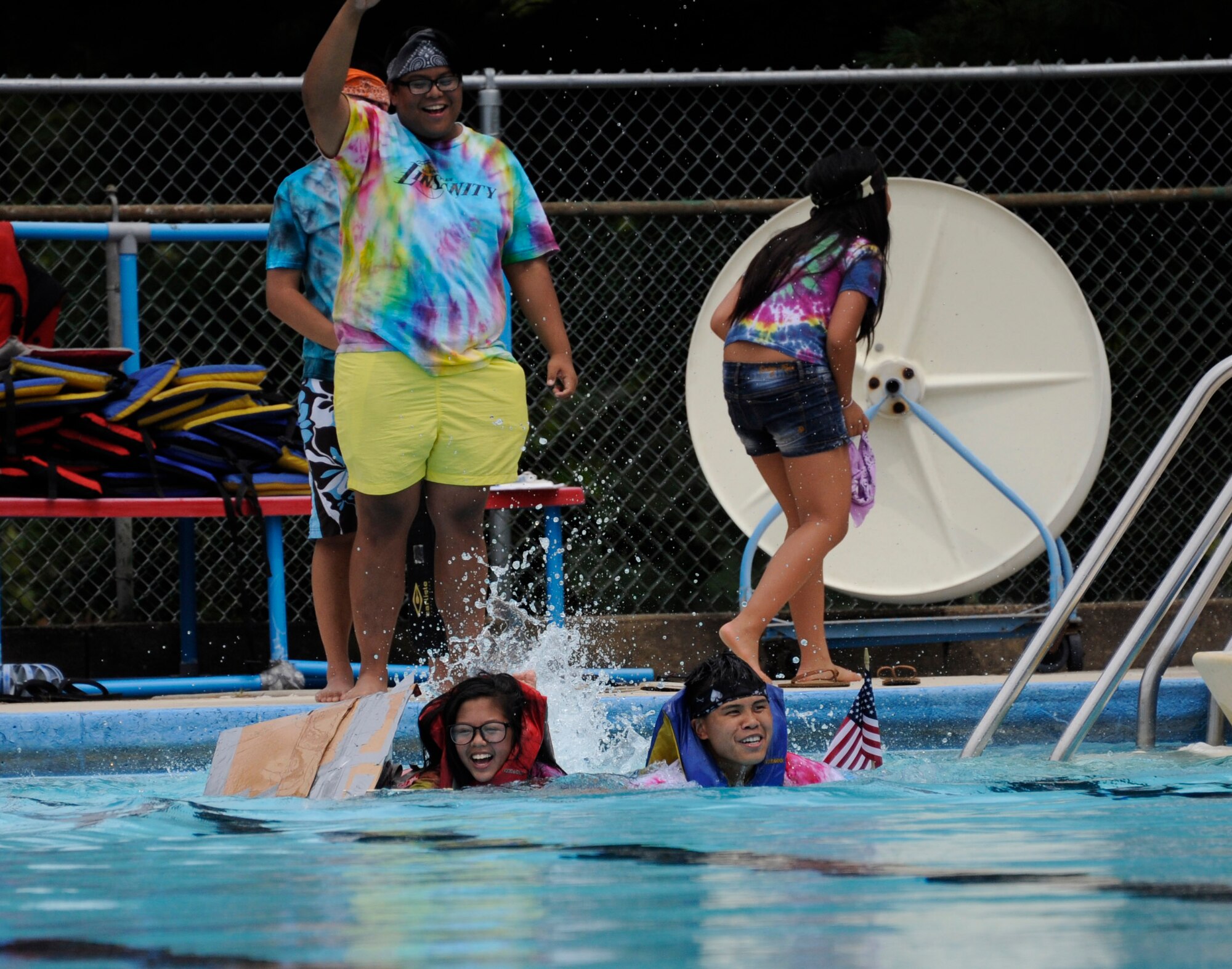 The Fourth Annual Cardboard Boat Regatta was held at the Dix Outdoor Pool on Joint Base McGuire-Dix-Lakehurst, N.J. July 18, 2015. Nine crews consisting of service members and civilians, utilizing sheets of cardboard and duct tape, constructed boats from the initial planning stages to the actual floating of the boats in a contest to determine the fastest time, unique theme, team spirit and dramatic sinking. (U.S. Air Force photo by Pascual Flores)