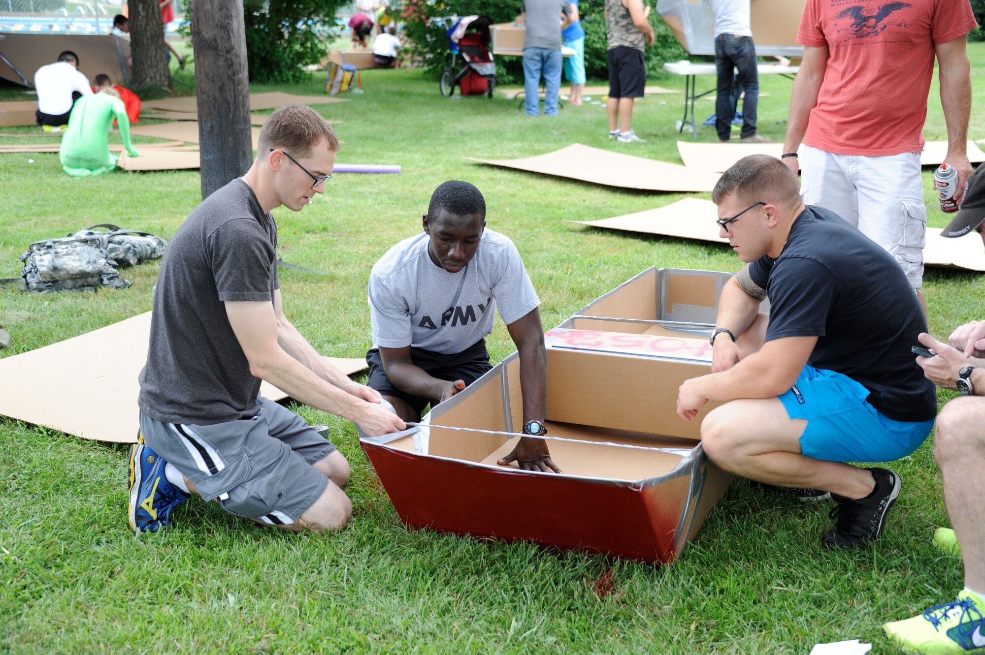 The Fourth Annual Cardboard Boat Regatta was held at the Dix Outdoor Pool on Joint Base McGuire-Dix-Lakehurst, N.J. July 18, 2015. Nine crews consisting of service members and civilians, utilizing sheets of cardboard and duct tape, constructed boats from the initial planning stages to the actual floating of the boats in a contest to determine the fastest time, unique theme, team spirit and dramatic sinking. (U.S. Air Force photo by Pascual Flores)