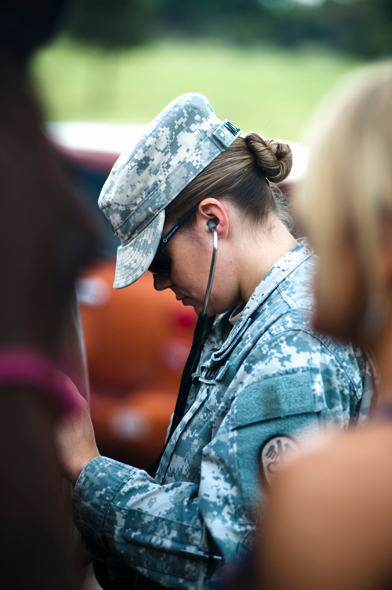 Army Capt. Shannon McLean listens to Geannie's abdomen during an examination on July 17, 2015. Geannie and her owner Chrissy Belcher traveled from Oklahoma participating in the Horses for Heroes event that is part of D.A. Russell Days. (U.S. Air Force photo by Katherine Oriez)
