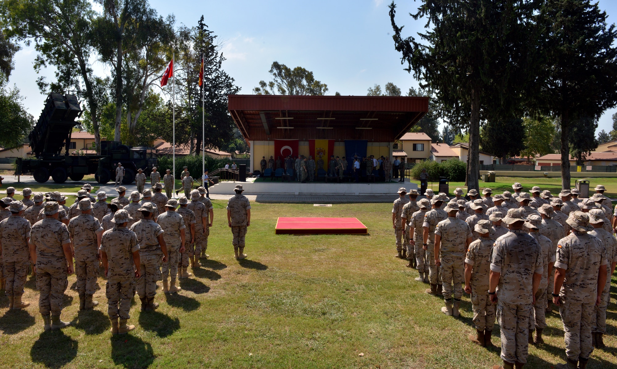 The Spanish Patriot Unit stands in formation awaiting the Transfer of Authority ceremony July 22, 2015, at Incirlik Air Base, Turkey. The Spanish are deployed to Incirlik in support of Operation Active Fence as part of the NATO patriot missile support deployment, which includes the missile batteries operated by the U.S. and Germany located respectively in two other areas within Turkey: Gaziantep and Kahramanmaras. (U.S. Air Force photo by Senior Airman Michael Battles/Released)