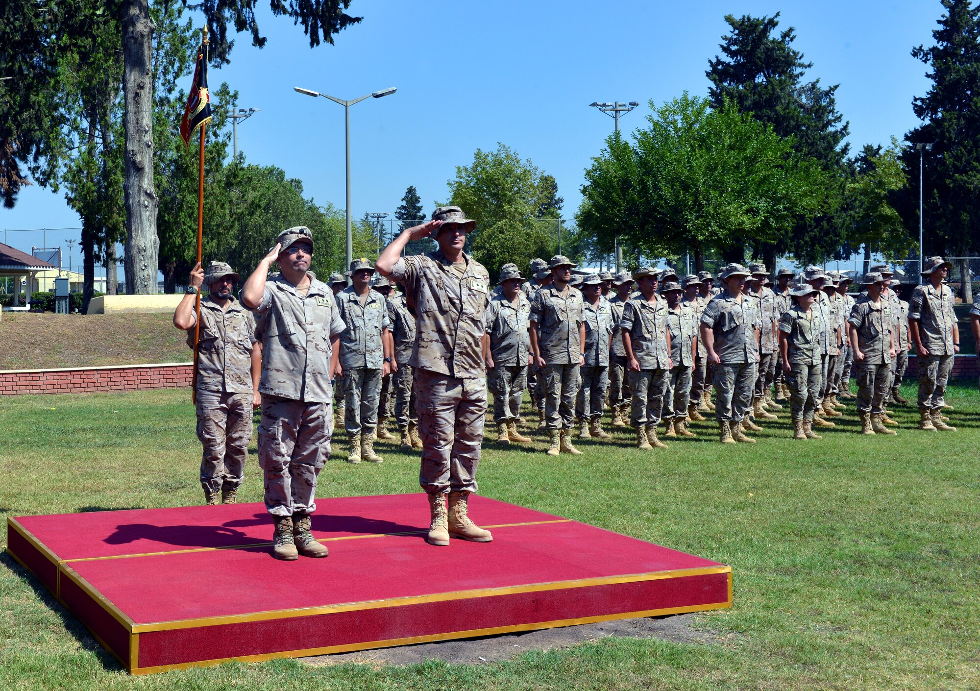 Spanish CDR. Jorge Cotorruelo, (left) outgoing Spanish Patriot Unit commander, and Army Artillery LTC Juan Castilla, incoming SPU commander, render a salute during a Transfer of Authority ceremony July 22, 2015, at Incirlik Air Base, Turkey. The Spanish military officially assumed command of the NATO patriot battery support mission from the 1st Netherlands Ballistic Missile Defense Task Force during a change of responsibility ceremony in January. (U.S. Air Force photo by Senior Airman Michael Battles/Released)