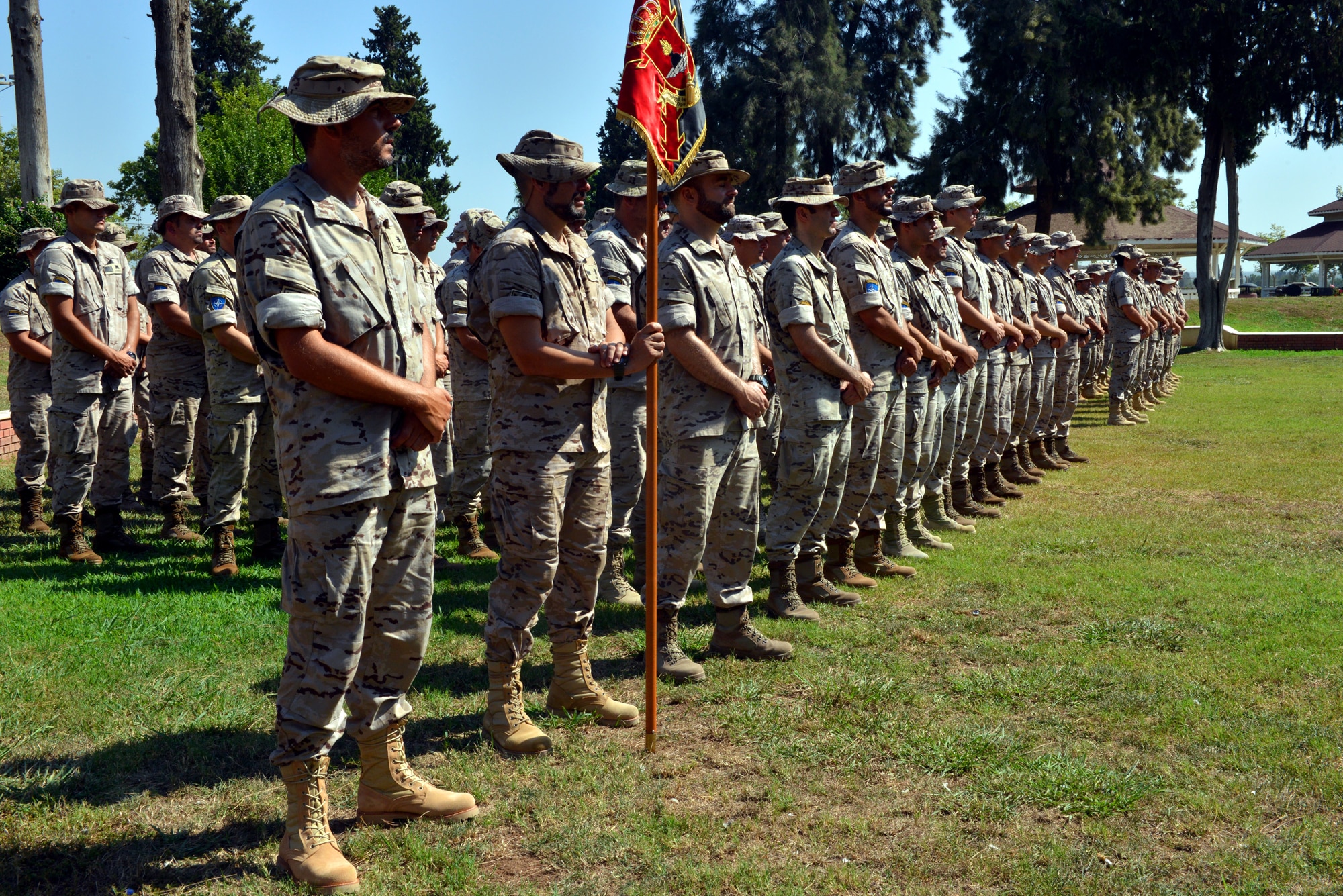 Soldiers from the Spanish Patriot Unit stand in formation awaiting the Transfer of Authority ceremony July 22, 2015, at Incirlik Air Base, Turkey. Spanish CDR. Jorge Cotorruelo, outgoing Spanish Patriot Unit commander, relinquished command to Army Artillery LTC Juan Castilla, incoming SPU commander. (U.S. Air Force photo by Senior Airman Michael Battles/Released)