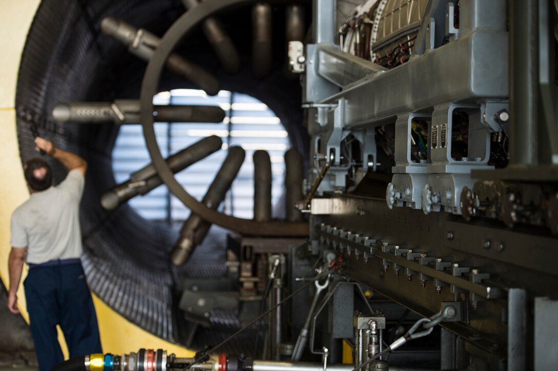 A U.S. Air Force Airman inspects the test site prior to an engine run at Langley Air Force Base, Va., July 22, 2015. The engine run was held in the 1st Maintenance Group’s “hush house,” a noise suppression system that prevents testing from disturbing the installation or the surrounding community. (U.S. Air Force photo by Senior Airman Kayla Newman/Released)