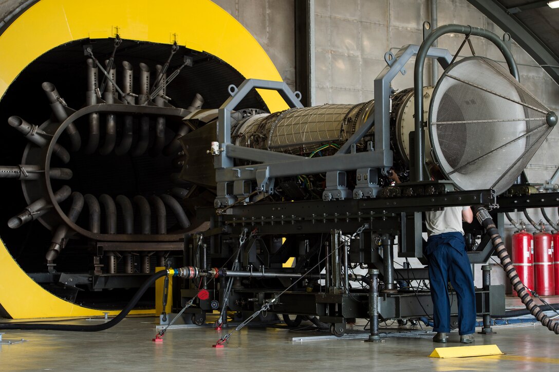 A U.S. Air Force Airman inspects an F-22 Raptor engine at Langley Air Force Base, Va., July 22, 2015. Propulsion technicians check engines for faults or leaks prior to performing tests. (U.S. Air Force photo by Senior Airman Kayla Newman/Released)