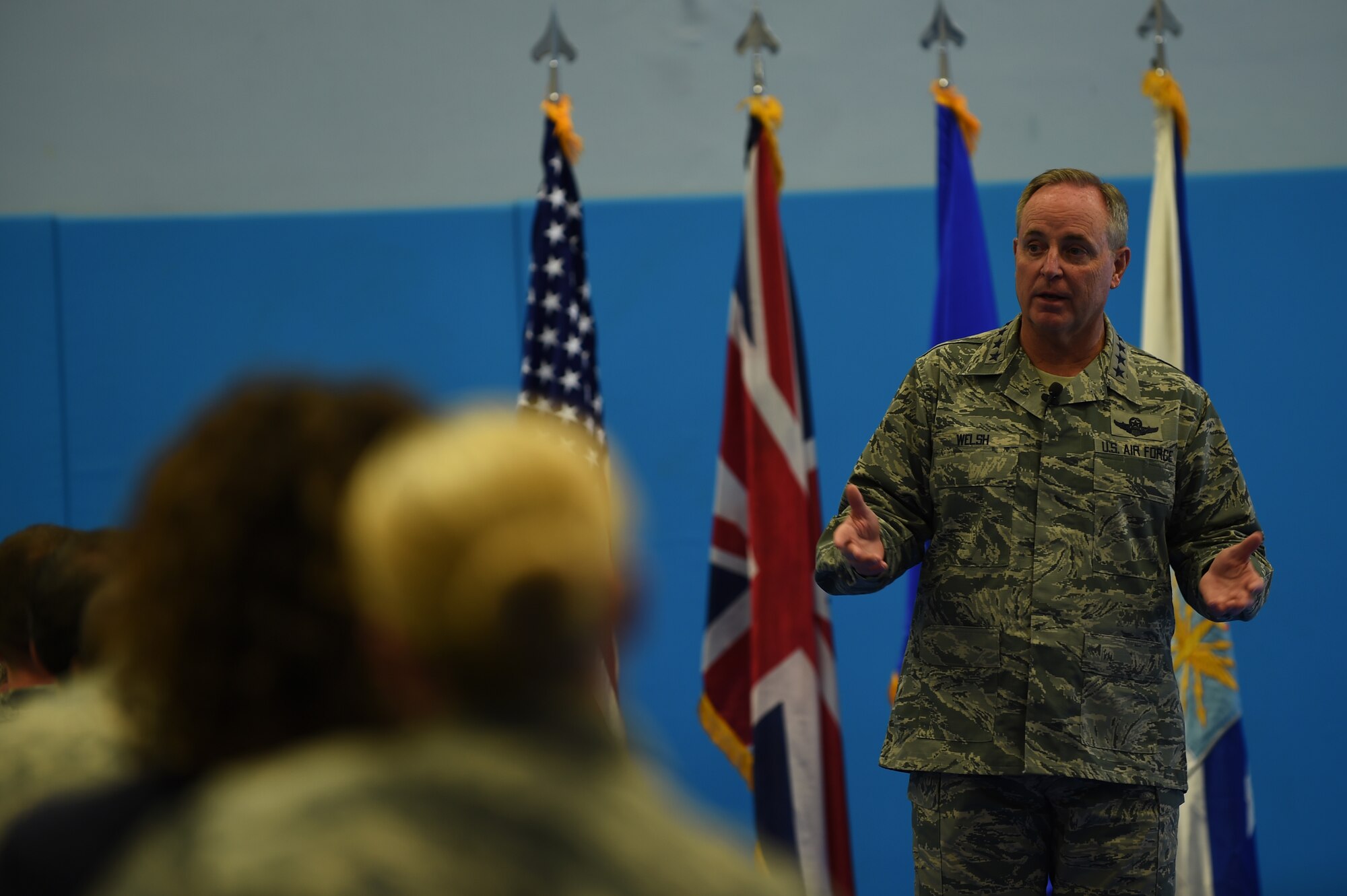 Gen. Mark A. Welsh III, U.S. Air Force Chief of Staff, speaks to Airmen during an all-call at RAF Croughton, United Kingdom, July 16, 2015. During the event, Welsh discussed the future of force development, the new enlisted performance report system and the challenges of effectively communicating policy decisions with Airmen. (U.S. Air Force photo by Staff Sgt. Jarad A. Denton/Released)