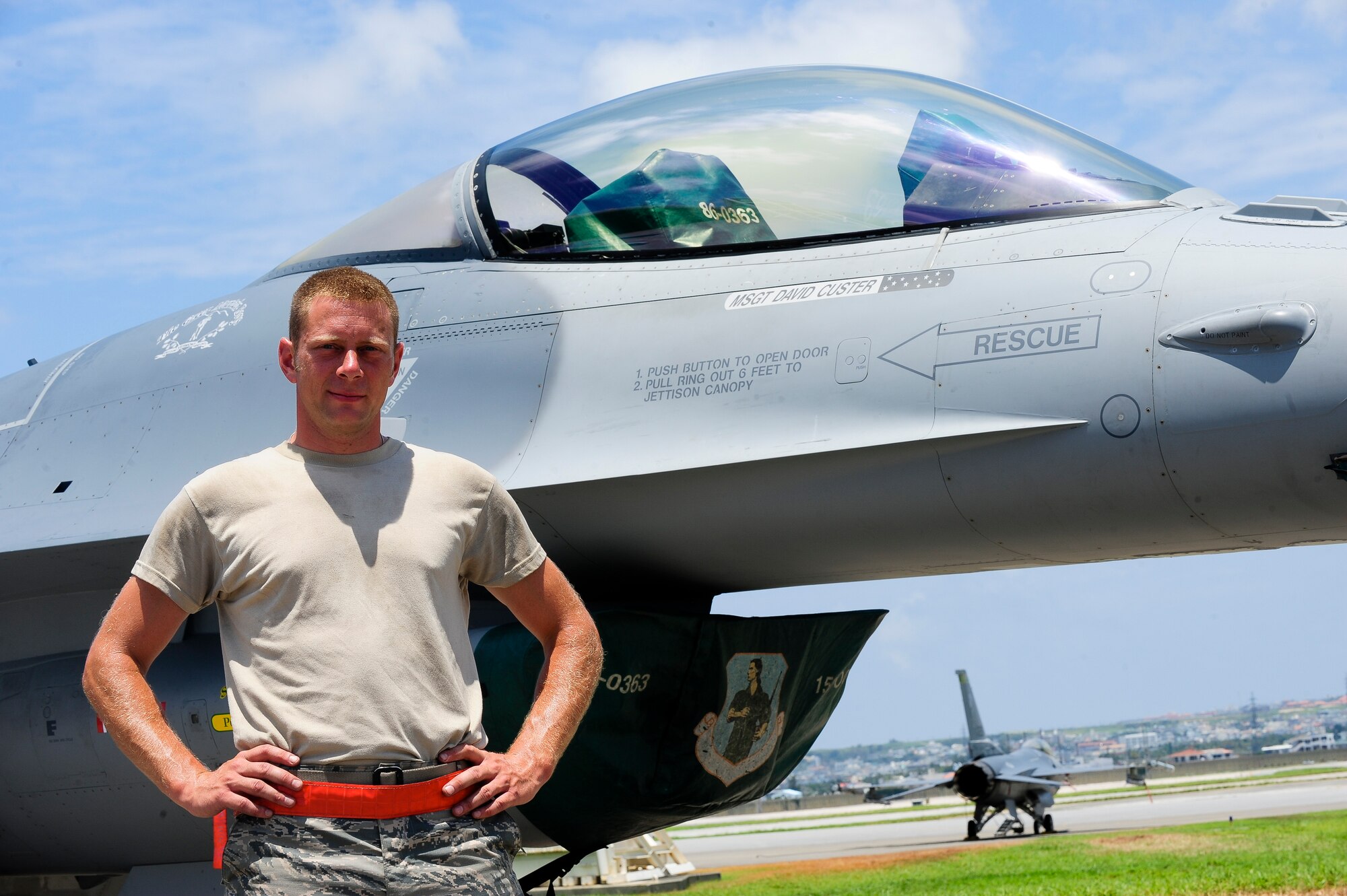 U.S. Air Force Master Sgt. David Custer, Vermont Air National Guard’s 158th Maintenance Squadron lead crew chief, stands in front of a U.S. Air Force F-16 Fighting Falcon July, 16, 2015, on Kadena Air Base, Japan. His name can be found printed on the right side of the aircraft as he is held responsible for ensuring the jet is properly maintained. The 158th ANG Fighter Wing is providing a theater security package throughout the Indo-Asia-Pacific region. (U.S. Air Force photo by Airman 1st Class John Linzmeier) 