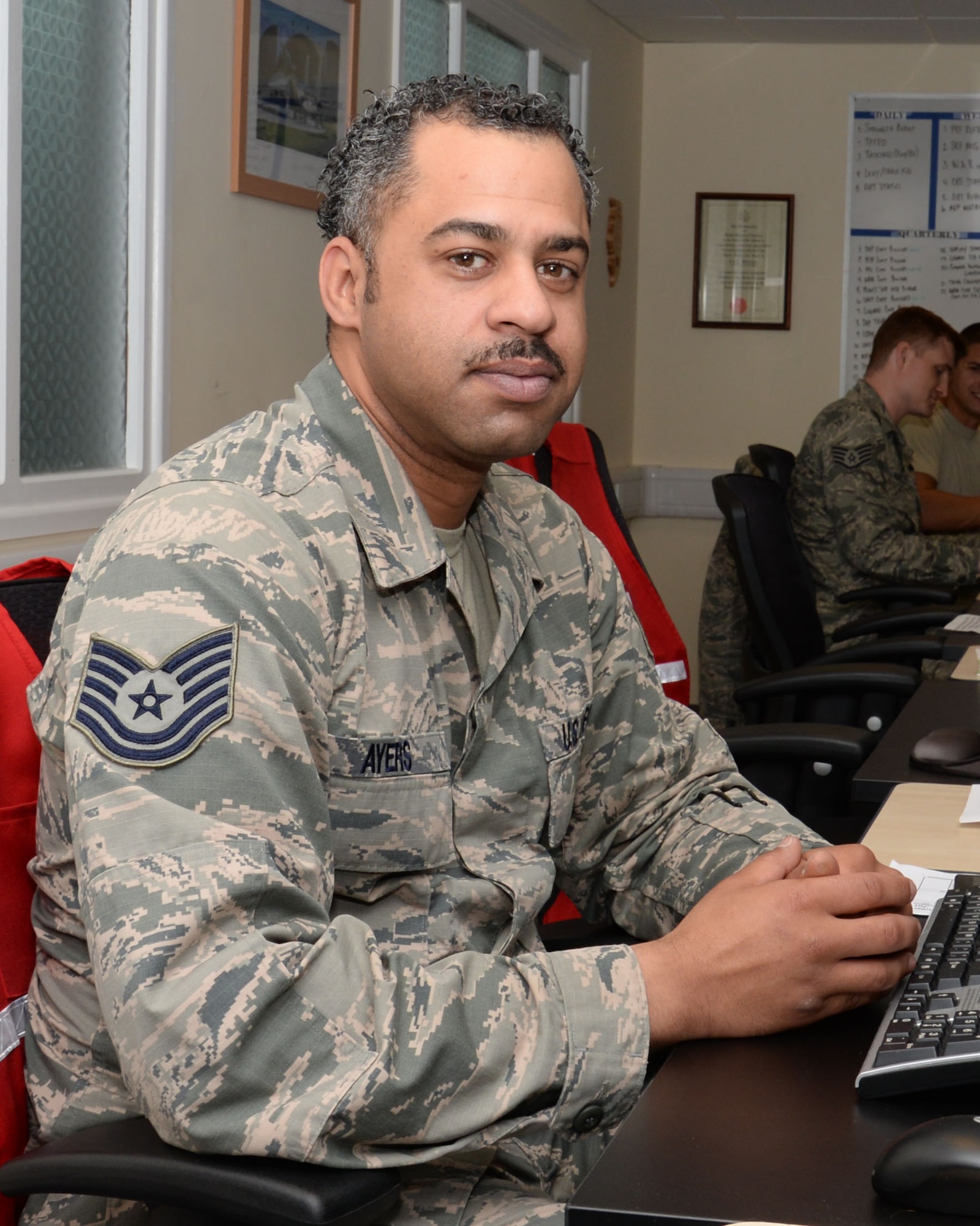 U.S. Air Force Tech. Sgt. Dury Ayers, 100th Logistics Readiness Squadron NCO in charge of deployment operations from Lackland Air Force Base, Texas, poses for a photograph July 21, 2015, on RAF Mildenhall, England. Ayers was nominated for the Square D Spotlight for portraying the core value of Service Before Self. (U.S. Air Force photo by Gina Randall/Released)