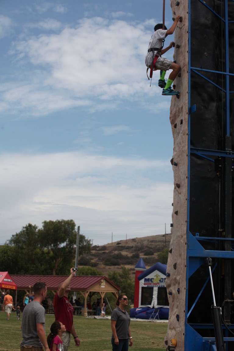 Marines and family members of 1st Intelligence Battalion participate in a family fun day aboard Marine Corps Base Camp Pendleton, Calif., July 1, 2015. The family fun day allowed Marines and families of 1st Intel Battalion to celebrate their success and build camaraderie within the unit.