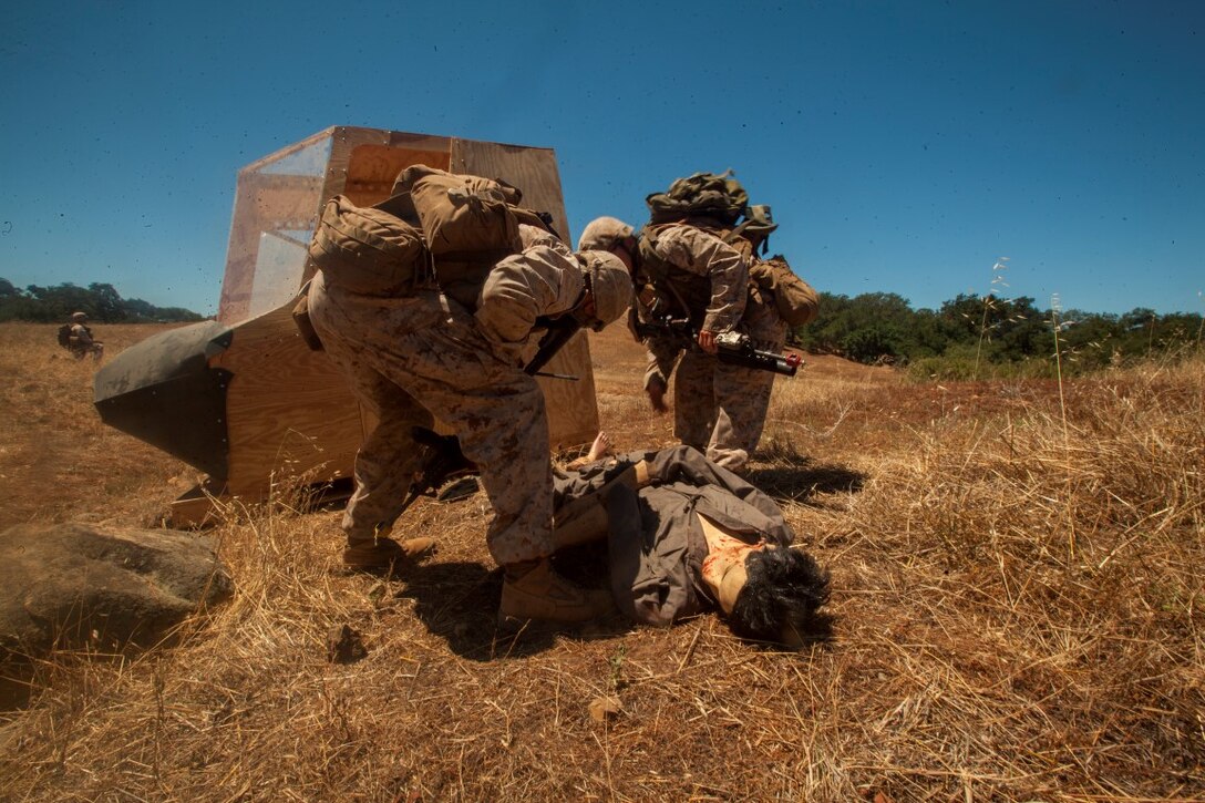Infantry Marines with 3rd Platoon, Company C, 1st Battalion, 7th Marines, locate and assess a simulated victim near landing zone K Springs aboard Marine Corps Base Camp Pendleton, Calif., July 17, while conducting a tactical recovery of aircraft and personnel mission during a certification exercise for Special Purpose Marine Air-Ground Task Force Crisis Response Central Command 16.1. SPMAGTF-CR-CC is a fully capable crisis response unit with the ability to project power over the vast distances using organic air and ground combat assets.