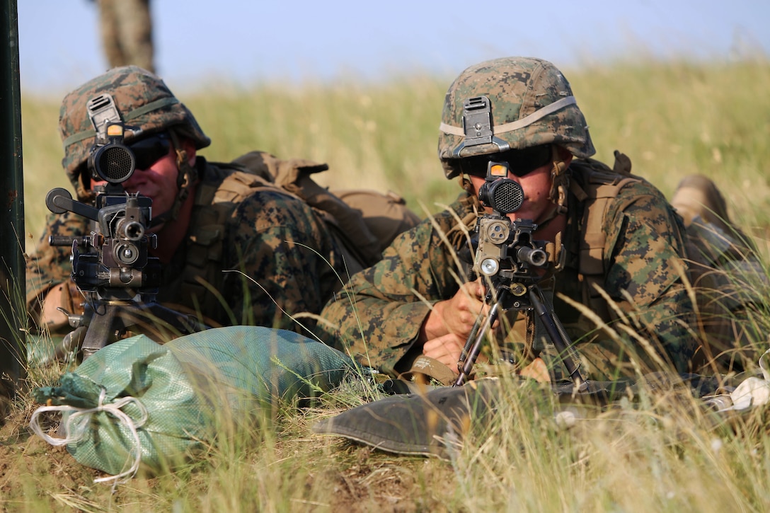 U.S. Marines with Golf Company, Black Sea Rotational Force, sight in at the support-by-fire position during a dry-run of the U.S. and Romanian platoon attack at Babadag Training Area, July 2.  This week-long engagement is part of a continuous military skills series between BSRF and the Romanian 307th Naval Infantry. (U.S. Marine Corps photo by 1st Lt. Sarah E. Burns)