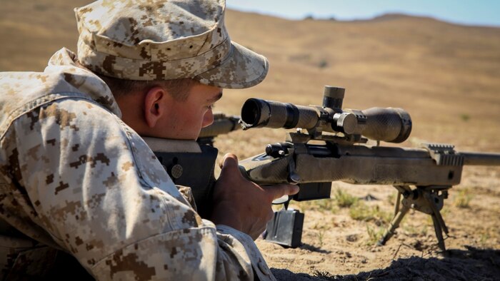 Marines with 1st Reconnaissance Battalion, 1st Marine Division, 1st Marine Expeditionary Force, conduct unknown distance shooting during the Pre-Scout Sniper Course at Marine Corps Base Camp Pendleton, California, July 17, 2015. The six-week long course is designed to prepare and screen students for the follow-on training at Scout Sniper Basic School