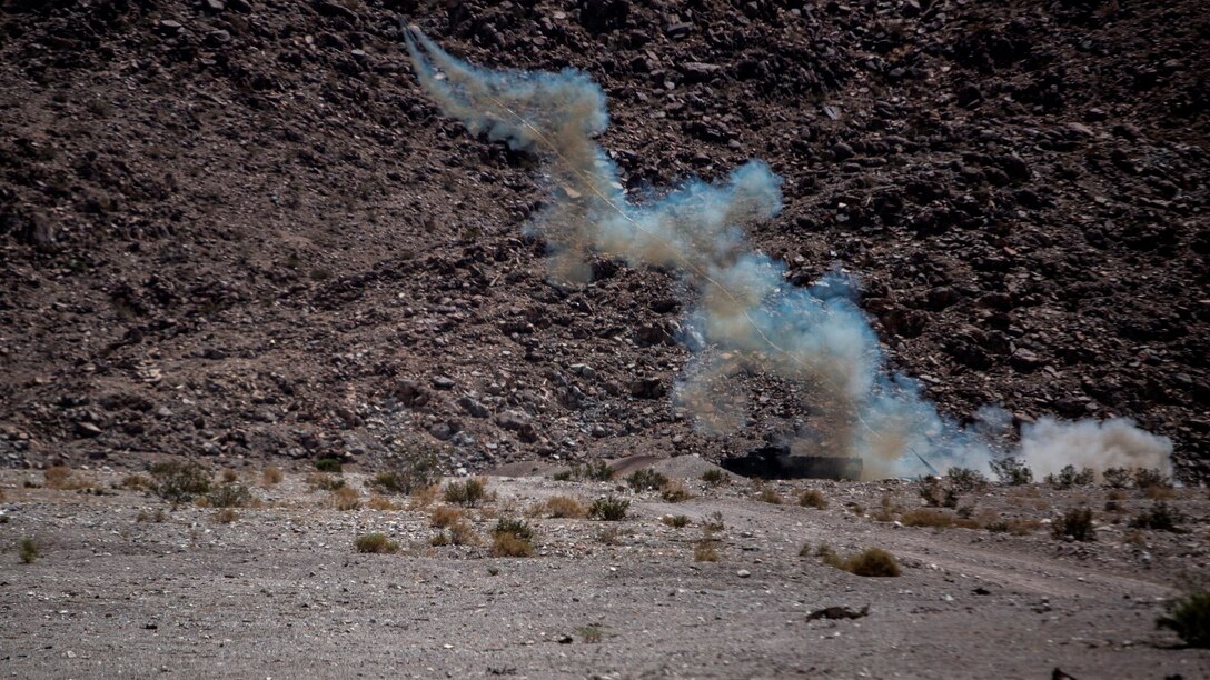 An Amphibious Assault Vehicle attached to 1st Battalion, 3rd Marine Regiment, launches an M58 Mine Clearing Line Charge during a live fire training exercise at Marine Corps Air Ground Combat Center Twentynine Palms, California, July 21. The MICLIC is a rocket projected explosive line charge which provides a "close-in" breaching capability for the Marine Corps. It is effective against conventionally fused land mines and, when detonated, provides a lane eight meters by 100 meters. 